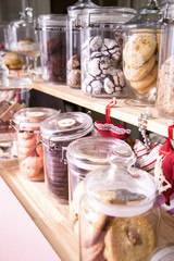 Various cakes and biscuits in a cafe on the counter