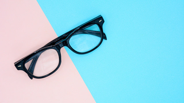 Black Glasses On Blue And Pink Background