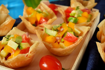 Vegetable salad served in filo tartlets