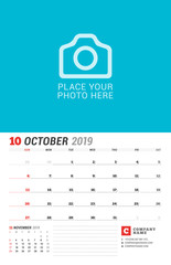 Obraz premium Wall calendar planner for 2019 year. October. Vector print template with place for photo. Week starts on Sunday