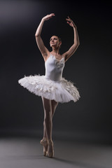 Ballerina dancing gracefully in the dark