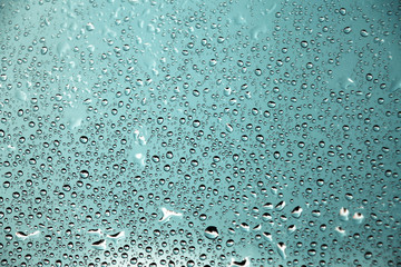 Turquoise background with small rain drops