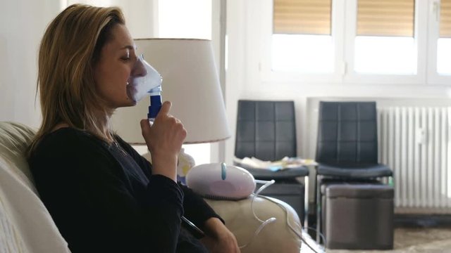 nebulizer aerosol woman inhaler machine medicine at home