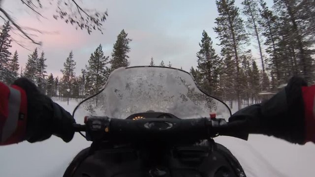 POV shot riding a snow mobil