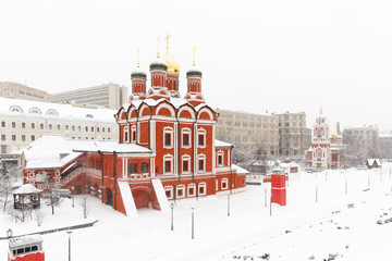 Heavy snowfall in Moscow. Snow-covered roads and Zaryadye Park with a view of the Monastery of Our Lady of the Sign.