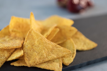 Nachos  on black slate board. Mexican food.