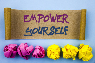 Handwriting text showing Empower Yourself. Concept meaning Positive Motivation Advice For Personal Development written on tear sticky note Paper on the blue background Folded paper