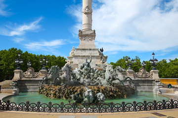 Fototapeta na wymiar Monument with a fountain & towering column erected to honor Girondin revolutionaries located at place de la Quinconces, Bordeaux, France