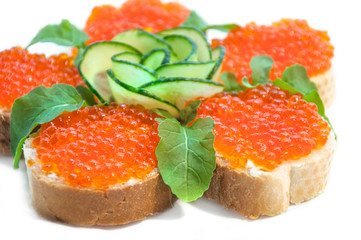 sandwiches with red caviar on white background
