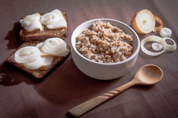 boiled buckwheat and bread with bacon and onions