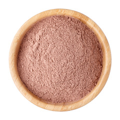 Cocoa powder in a wooden bowl isolated on white. Top view.