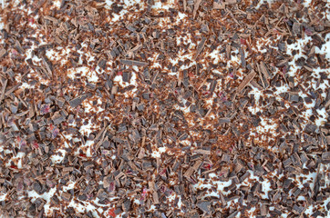 Confecionary background of crashed chocolate and cream