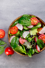 Fresh salad with baby spinach and tomato, radish und salad.