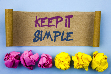 Handwriting text showing Keep It Simple. Concept meaning Simplicity Easy Strategy Approach Principle written on tear sticky note Paper on the blue background Folded paper