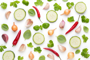 Vegetable and spices isolated on white background, top view. Wallpaper abstract composition of vegetables.