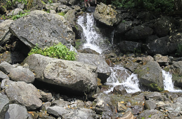 milky waterfall at lake Ritsa