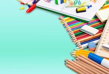 Fototapeta premium Colorful school supplies on background