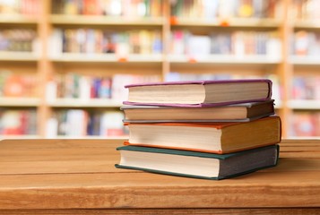 Stack books on wooden desk