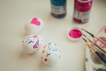 The Easter eggs paintings on white desk 