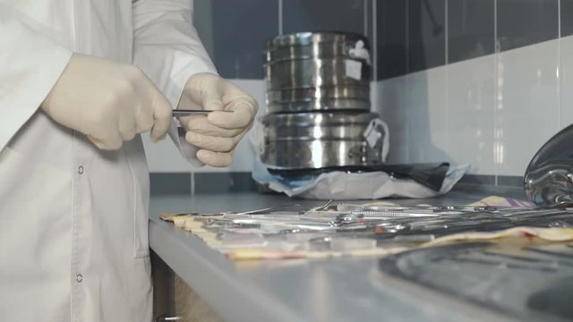 Close up view of checking the medical instruments in a lab. 4K.