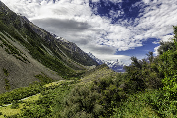 Trail between colorful slopes of mountains in Mount Cook National Park, South Island, New Zealand