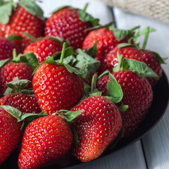 strawberries in a still life on a white background