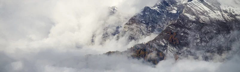 Fototapeten Luftbild der schönen Berglandschaft mit Wolken im Kanton Wallis © Sebastian