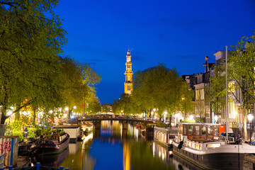 Fototapeta na wymiar Evening view on the Western church in Amsterdam, Netherlands