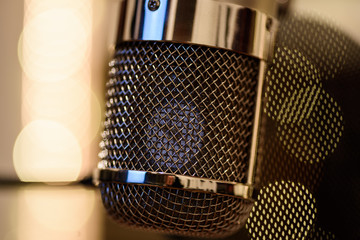 Chrome grilled recording studio tube microphone