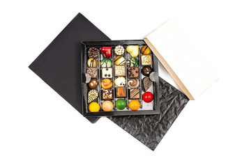 cardboard box with chocolate candies on a white background