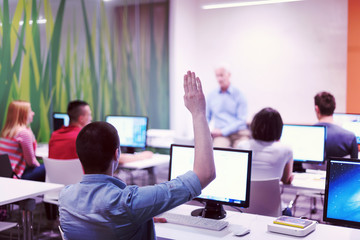 student answering a question in classroom