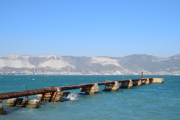 Old dismantled rusty pier. The destroyed pier