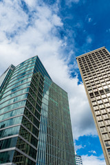 Fototapeta na wymiar downtown tall building under cloudy blue sky
