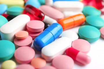 Many colorful pills as background