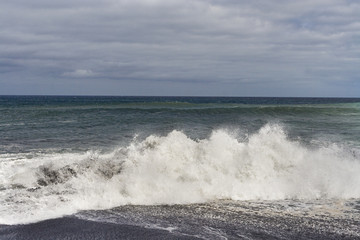 heavy waves with white wave crest in storm