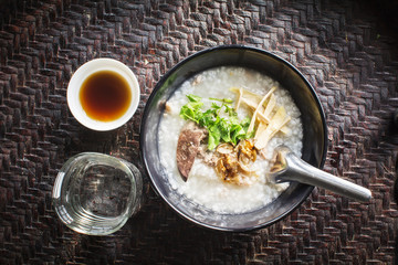 rice gruel in bowl on tablecloth in morning