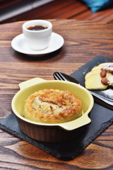 Meat pastry with coffee on wooden table             