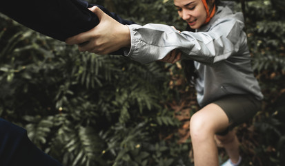 Hand holding hand helping