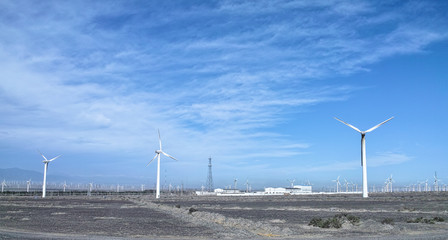 Fototapeta na wymiar Windmills in the grassland, Xinjiang