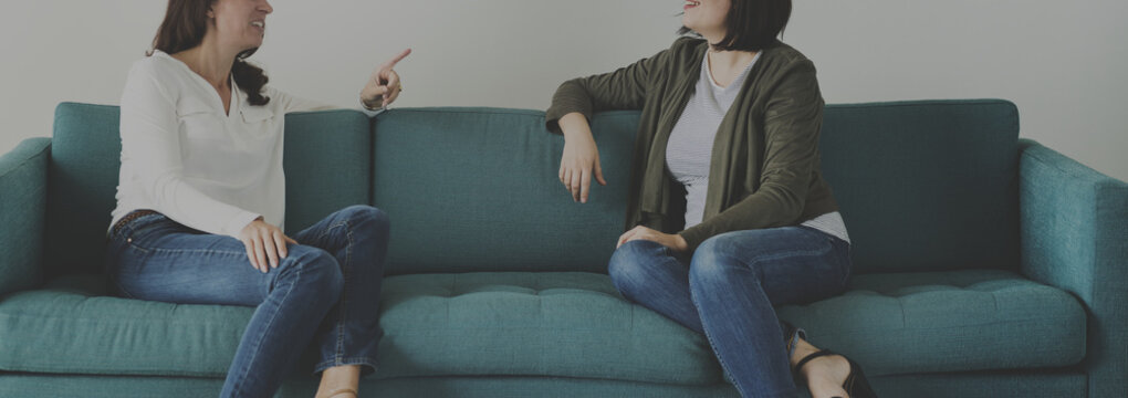 Women Talking Together On The Couch