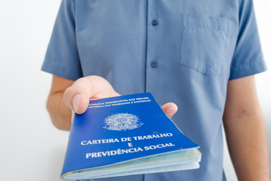 Unemployed Worker From Brazil Show His Work Permit Document (carteira De Trabalho In Portuguese) While Looking For A Job