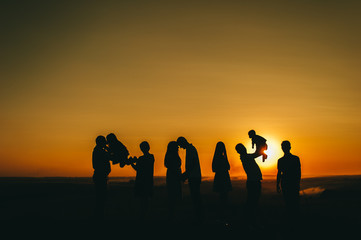family and beautiful sunset