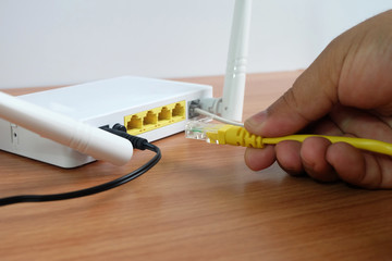 Modem router wifi wireless connect lan cable On wooden floor