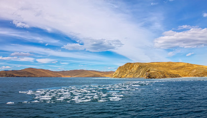 Lake Baikal in spring. View of the ice drift in the small sea from the coastal rocks