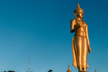 Fototapeta na wymiar A Budda statue on the top of Korhong Mt. with blue sky