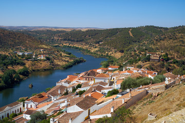 Fototapeta na wymiar View of Guadiana river bend and residential houses of Mertola city on the ripe. Mertola. Portugal
