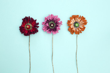 Three brooches made of felted wool in the form of a flower