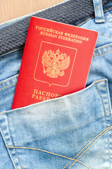 Russian red passport in jeans pocket