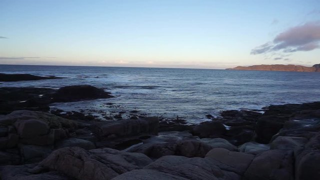 Beautiful landscape of round shape rocks beach with Barents Sea at the arctic coast  background in Terriberka, Russia