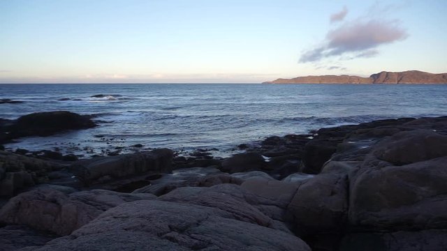 Beautiful landscape of round shape rocks beach with Barents Sea at the arctic coast  background in Terriberka, Russia